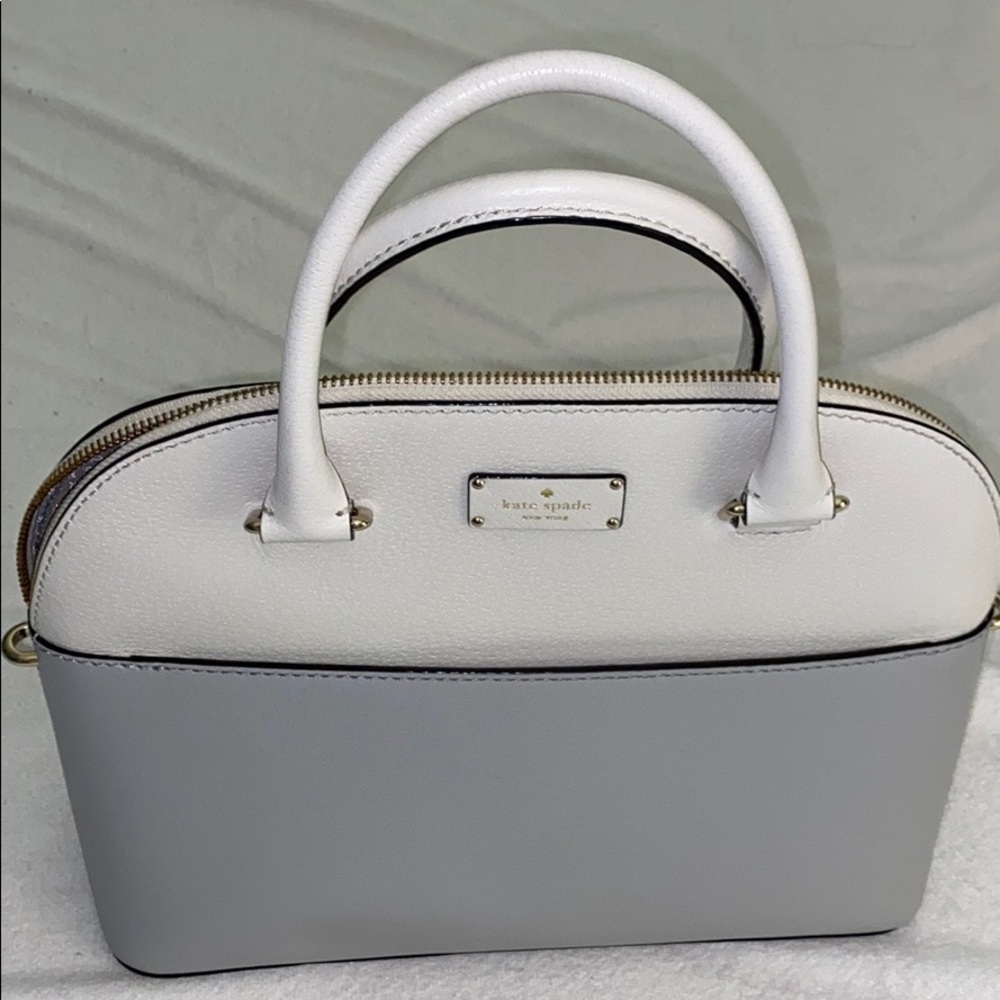 Gray and white Kate Spade bowling bag style bag